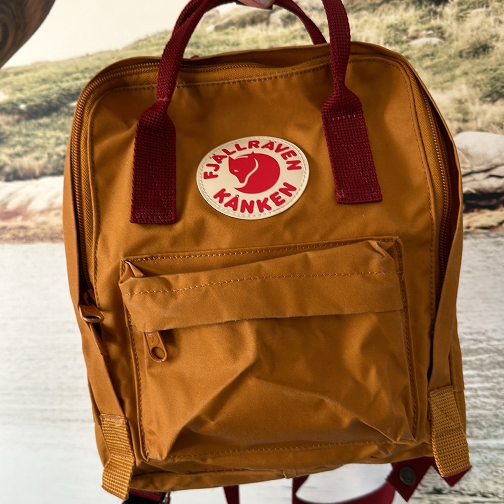 Fjällräven Kånken MINI. Mustard  red with red straps.